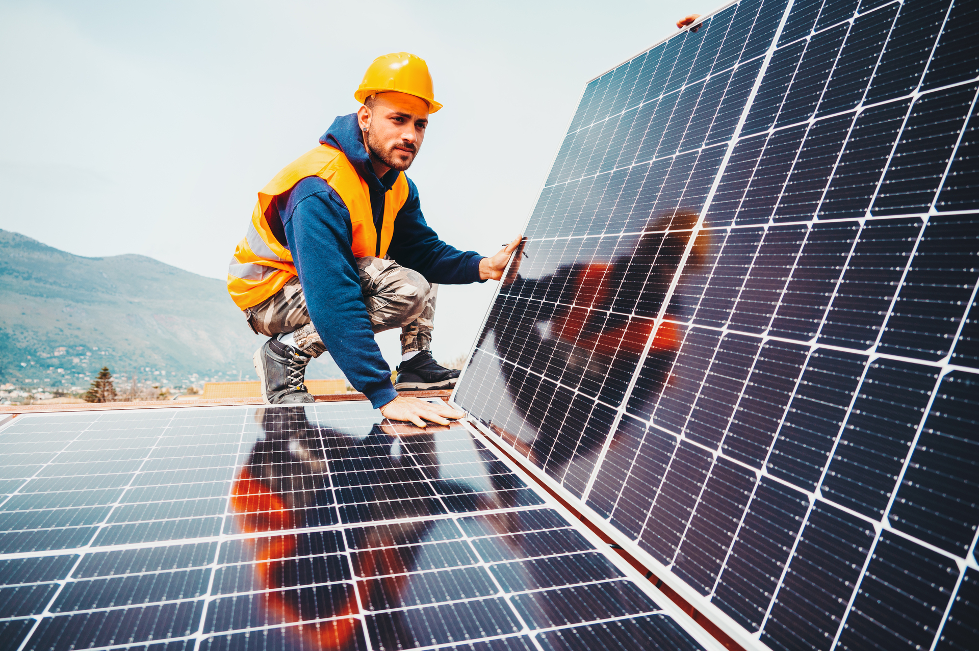 Solar installer at work on site